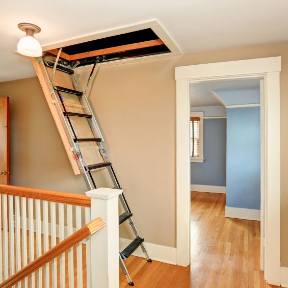 fold down ladder from ceiling leading to an attic or loft