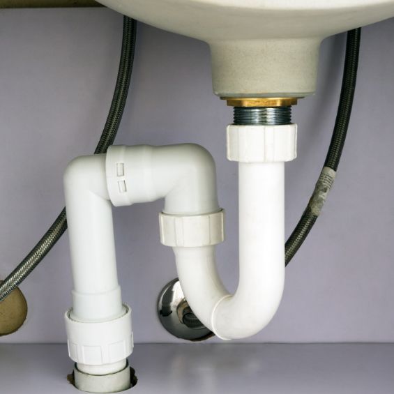pvc plumbing pipe under a kitchen or bathroom sink